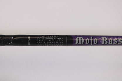Close-up of a St. Croix Mojo Bass MJC71MF Plastics used casting rod in very good condition, labeled "Mojo Bass," with specs: 7'1" Medium Power, Fast Action, SCIII Graphite, IPC Technology. Ideal for those seeking used gear or using our Rod and Reel Trade-In Program for store credit.