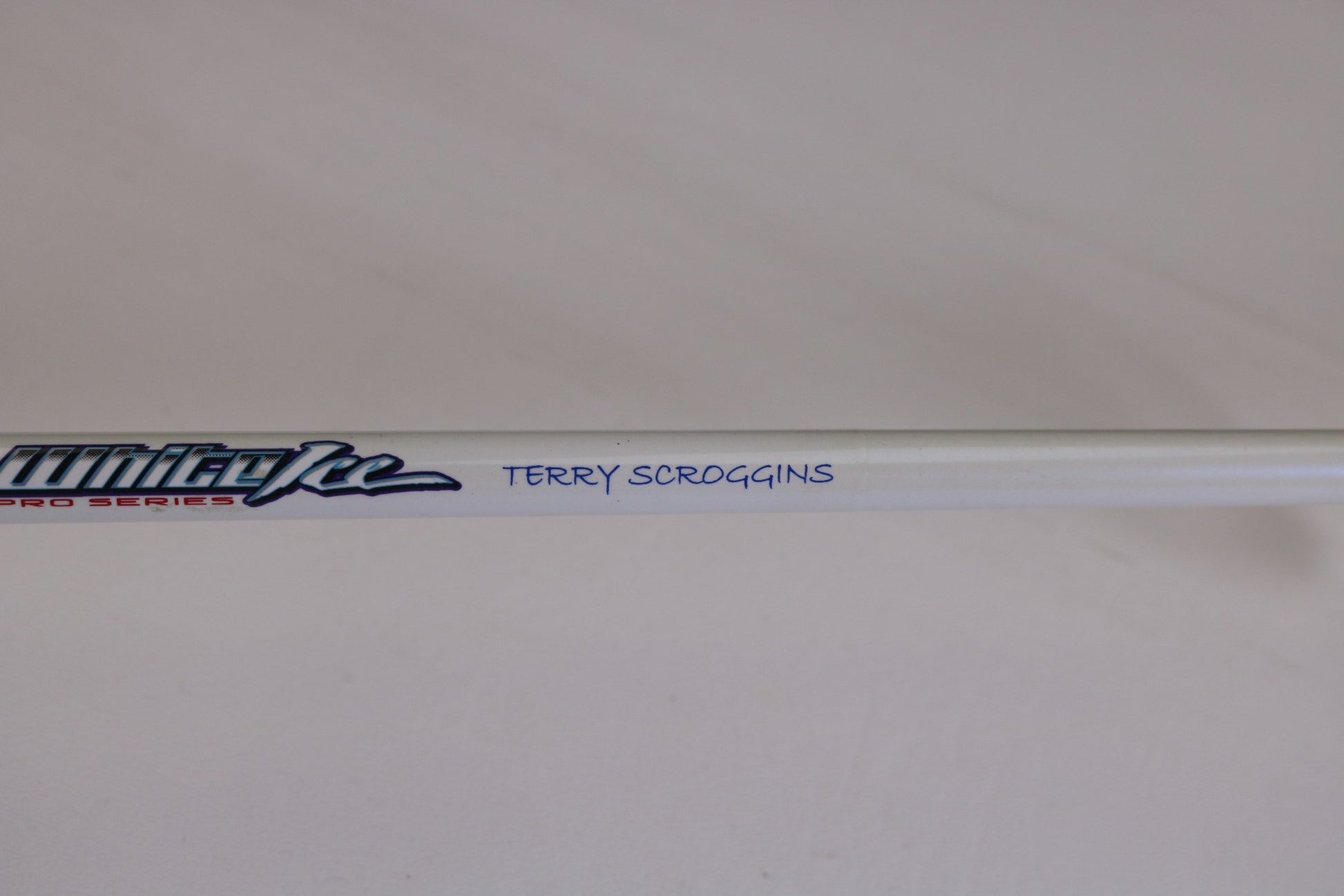 A Duckett White Ice TR-DFWI68MHS 6'8" Medium Heavy used spinning rod in good condition, featuring "Pro Series" and a blue handwritten "Terry Scroggins," ideal for quality gear seekers. Plain, light background. Eligible for our Trade-In program.