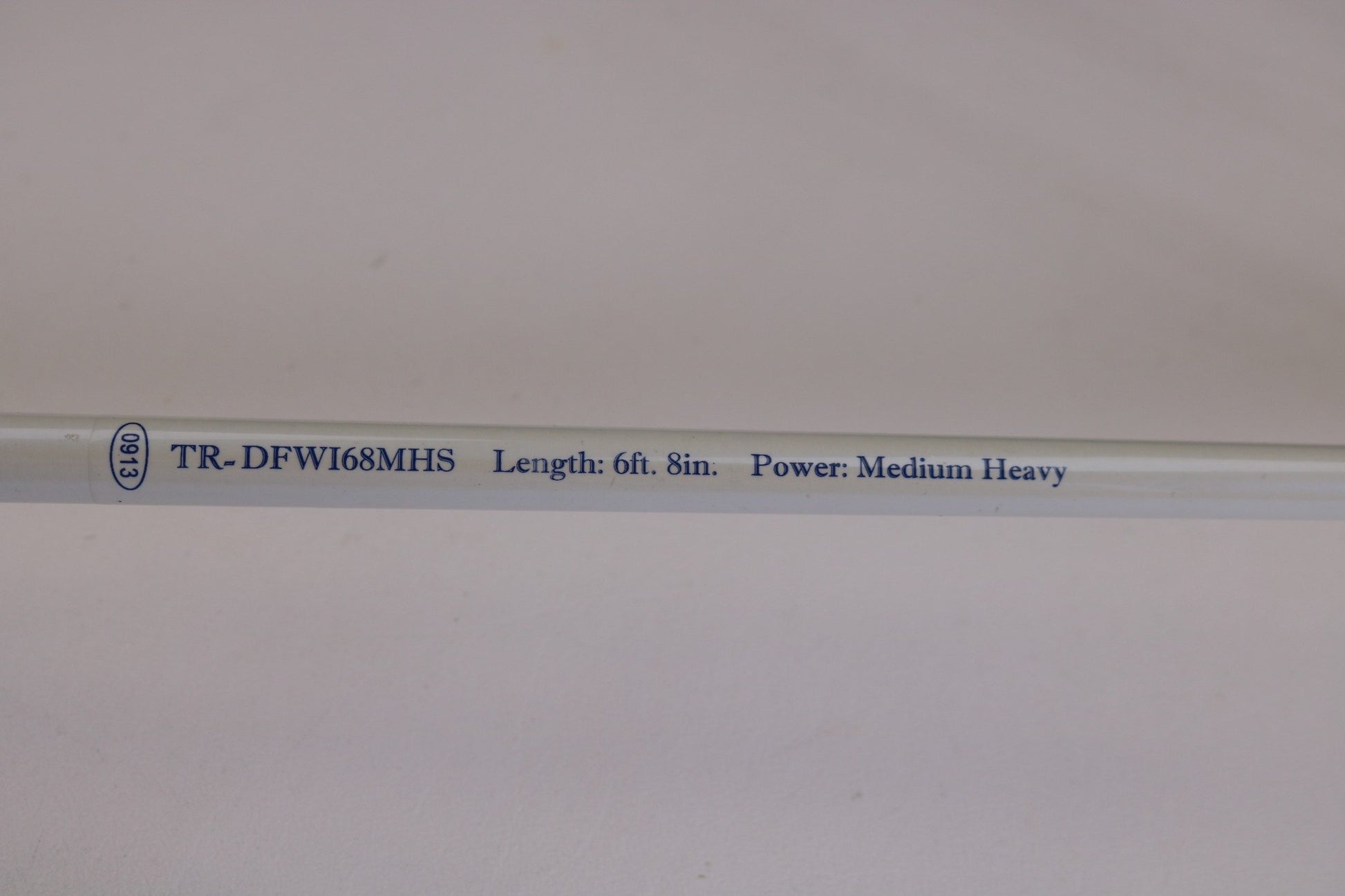 Close-up of a Duckett White Ice TR-DFWI68MHS 6'8" Medium Heavy Used Spinning Rod in good condition, perfect for trading in your used gear and earning store credit with our Rod and Reel Trade-In program.