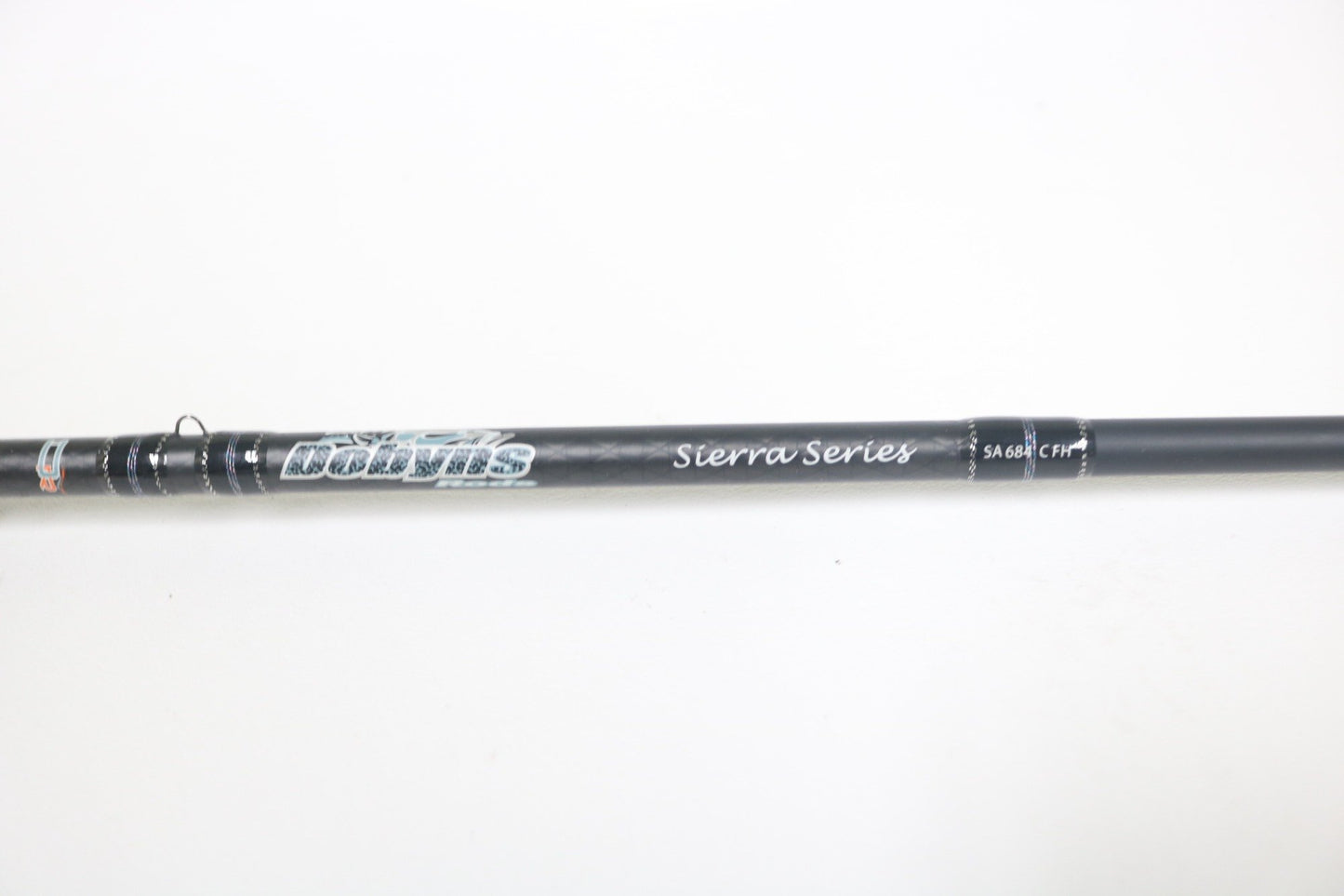 A close-up of a Dobyns Sierra SA684C Used Casting Rod in excellent condition, showing the brand name and details on the blank against a plain white background.