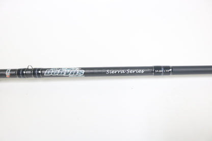 A close-up of a Dobyns Sierra SA684C Used Casting Rod in excellent condition, showing the brand name and details on the blank against a plain white background.