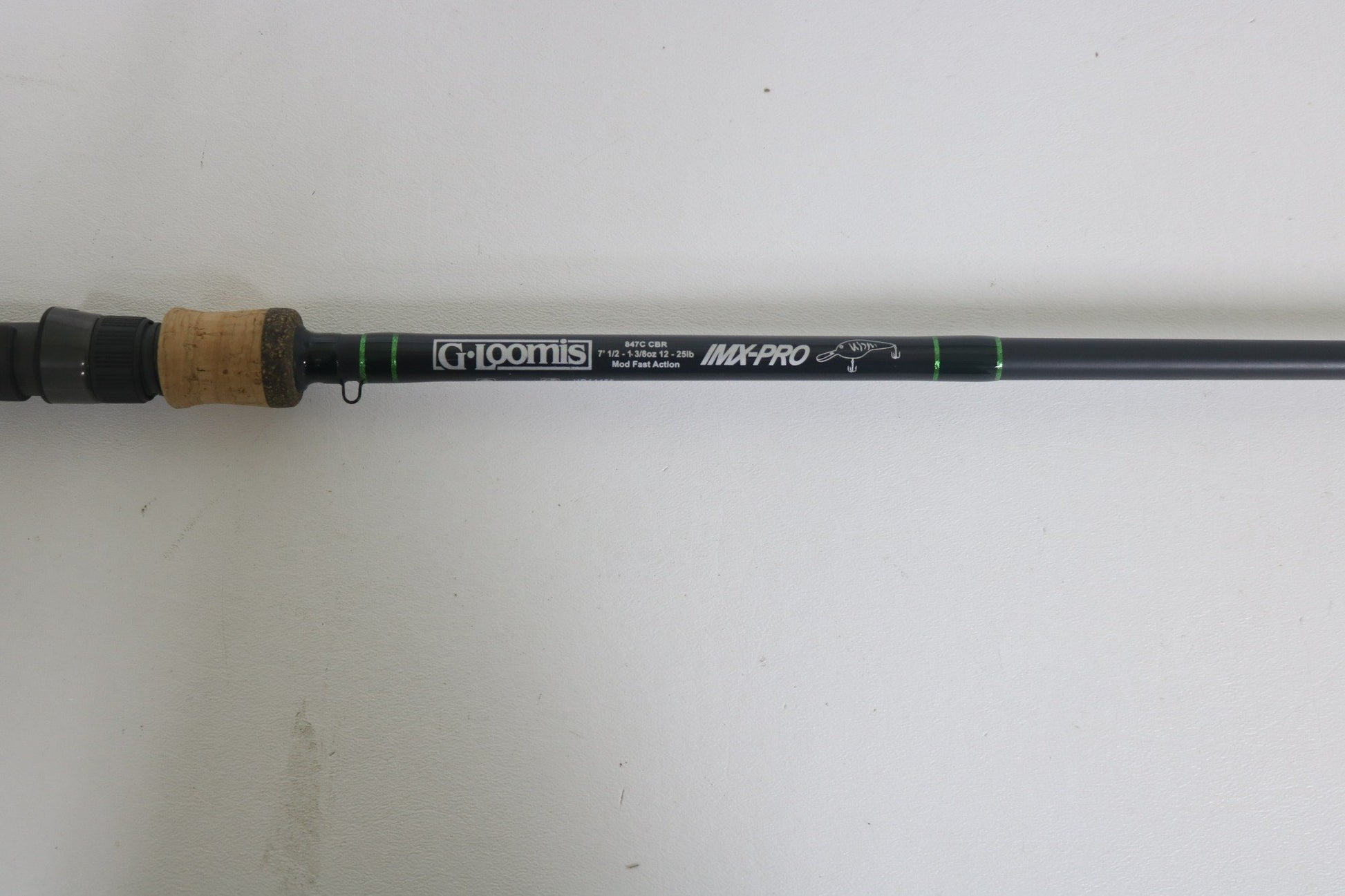 A close-up of a G. Loomis IMX-PRO 847C CBR 7'0" Heavy Used Casting Rod in excellent condition—ideal for our Rod and Reel Trade-In Program or upgrading your used gear for store credit.