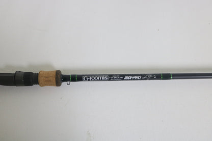A G. Loomis IMX-Pro 843C CBR casting rod in excellent condition features a cork handle and black shaft with specifications in white text, set on a plain white background.