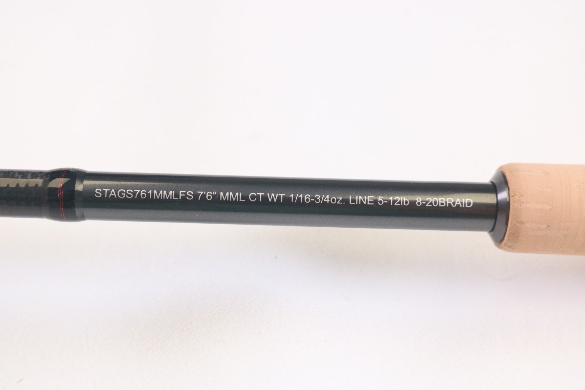 Close-up of Daiwa Steez AGS STAGS761MMLFS The One 7'6" Medium Medium Light used spinning rod in mint condition, with specs "CT WT 1/16-3/4oz. LINE 5-12lb 8-20BRAID"—ideal for quality fishing gear seekers or trade-in program.