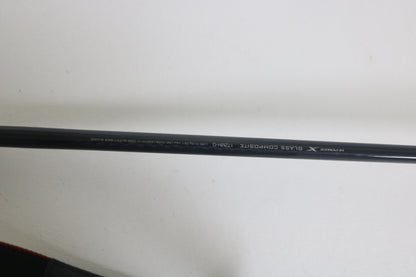 A close-up of a Shimano Expride A EX172MHGA used casting rod in excellent condition shows "GLASS COMPOSITE 7'2"MH" and "X" on its black surface, photographed against a plain white background.