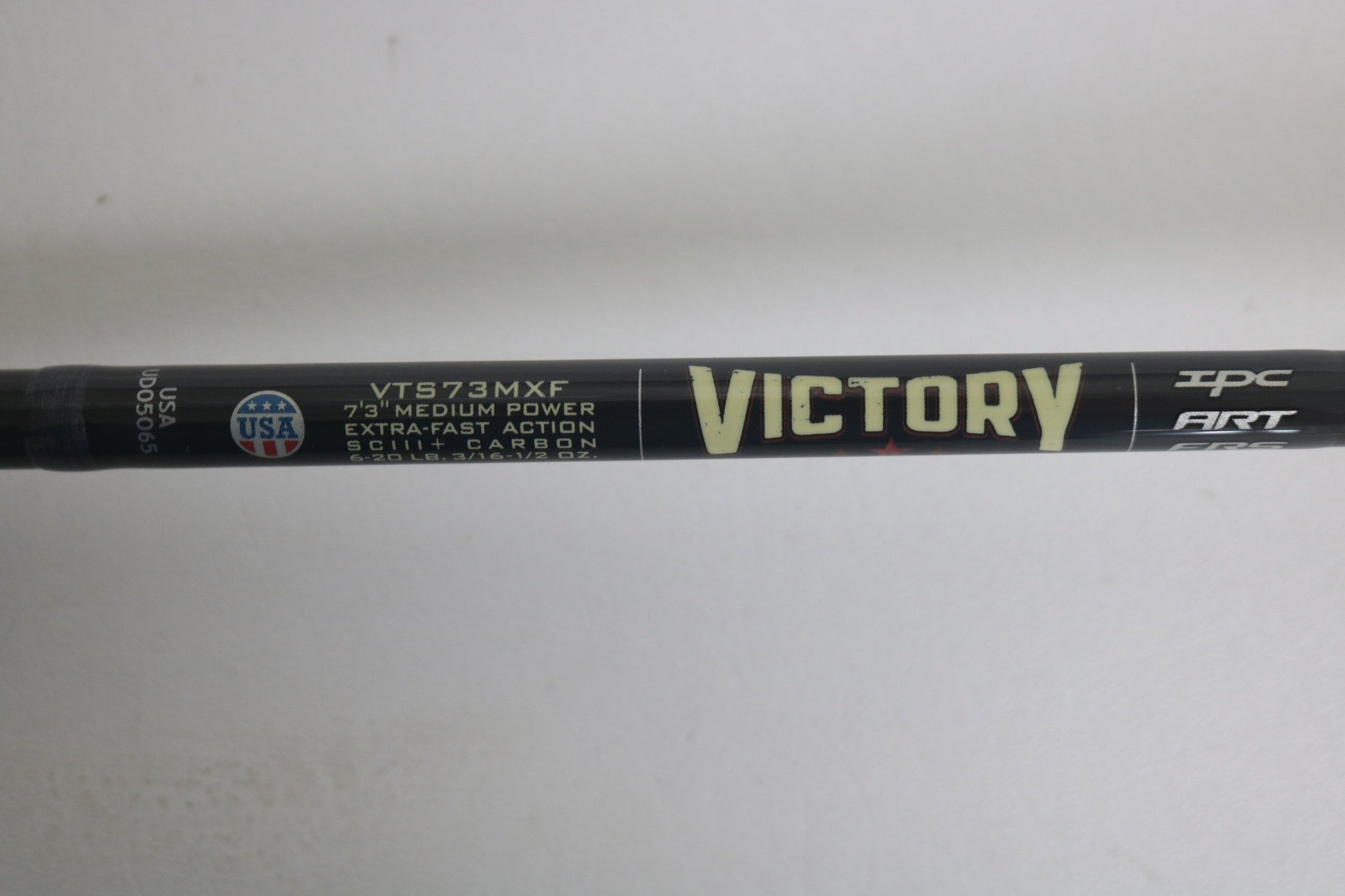 A close-up shows the St. Croix Victory VTS73MXF Used Spinning Rod in excellent condition, featuring "VICTORY," "VTS73MXF," "7'3" medium power, extra-fast action," "SCIII+ carbon," and a small USA flag logo on the left side.