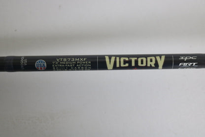 A close-up shows the St. Croix Victory VTS73MXF Used Spinning Rod in excellent condition, featuring "VICTORY," "VTS73MXF," "7'3" medium power, extra-fast action," "SCIII+ carbon," and a small USA flag logo on the left side.