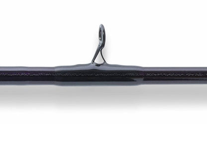 Close-up of a rod guide on the St. Croix Mojo Jig 5'8" Heavy Conventional Rod (MJJC58HMF), showing the metal loop on this dark saltwater jigging rod, ideal for vertical jigging, against a white background.
