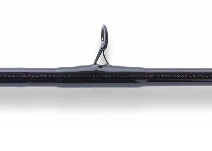 A close-up shows the St. Croix Mojo Jig 5'8" Extra Heavy Conventional Rod (MJJC58XHMF) with a single line guide, highlighting its precision and quality against a white background.