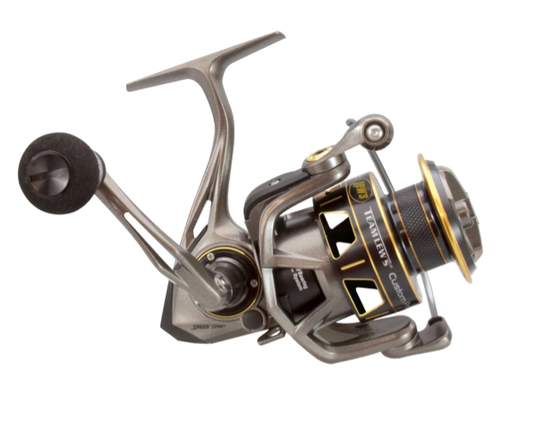 A Lew's Team Custom Pro Speed Spin 1000 spinning reel with a black handle and gold accents, plus "Lew's" branding, features a carbon multi-disc drag system and is shown from the side on a white background.
