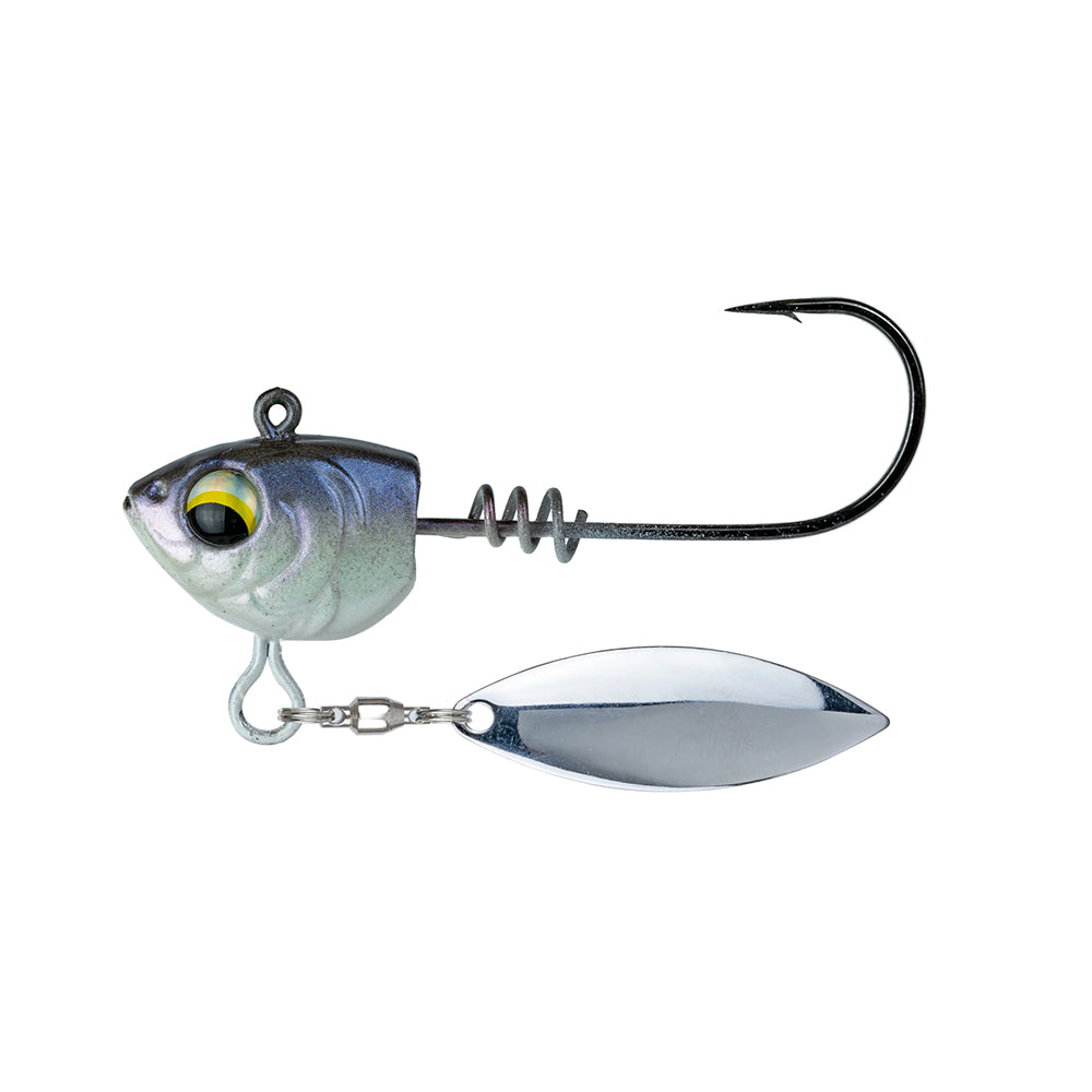 The 6th Sense Divine Underspin by 6th Sense is a metallic fish-head jig featuring a large yellow eye, screwlock keeper, curved hook, and shiny silver blade below—ideal as an underspin jig for enticing strikes.