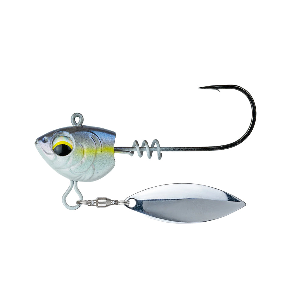 The 6th Sense Divine Underspin is a fish-head shaped jig with a large hook, screwlock keeper, shiny oval spinner blade underneath, realistic painted eye, and comes in silver with yellow accents.