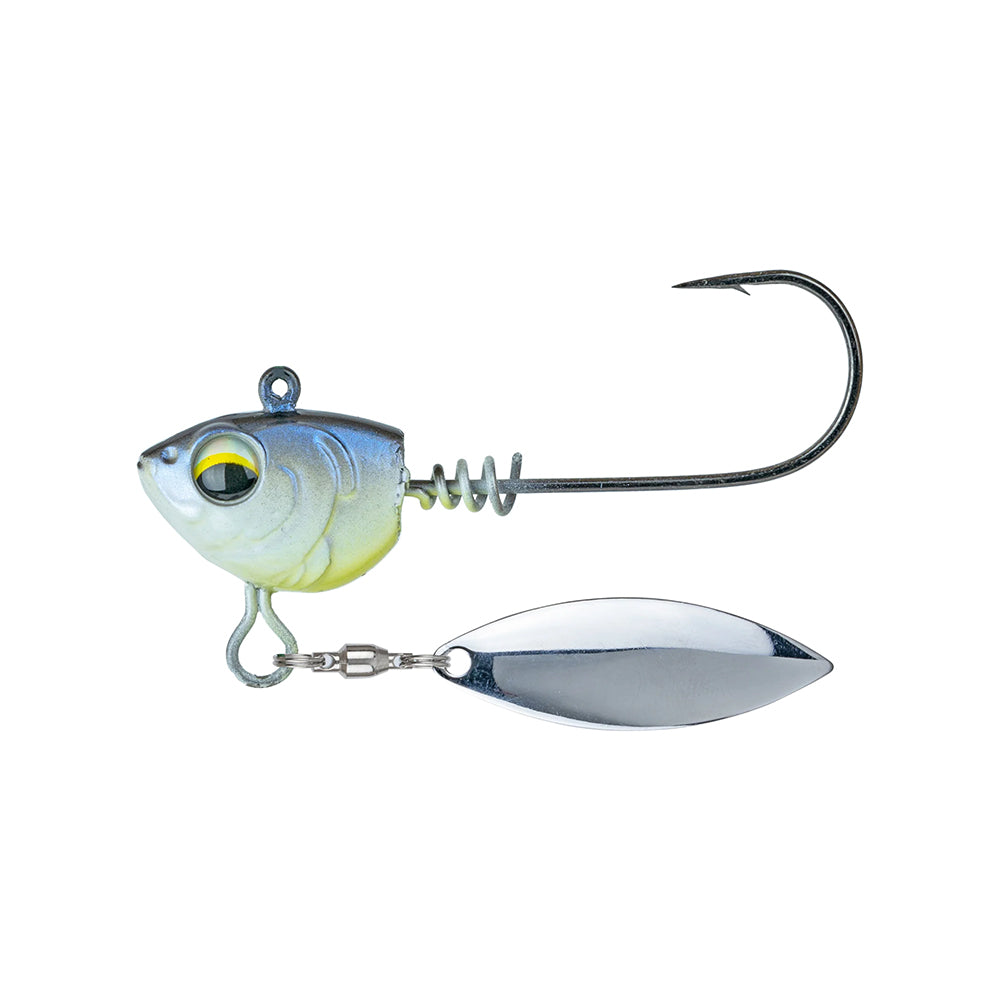 The 6th Sense Divine Underspin features a fish-head design with a realistic eye, metallic blue and yellow finish, a large hook, and a shiny silver blade on a swivel for lifelike fishing action.