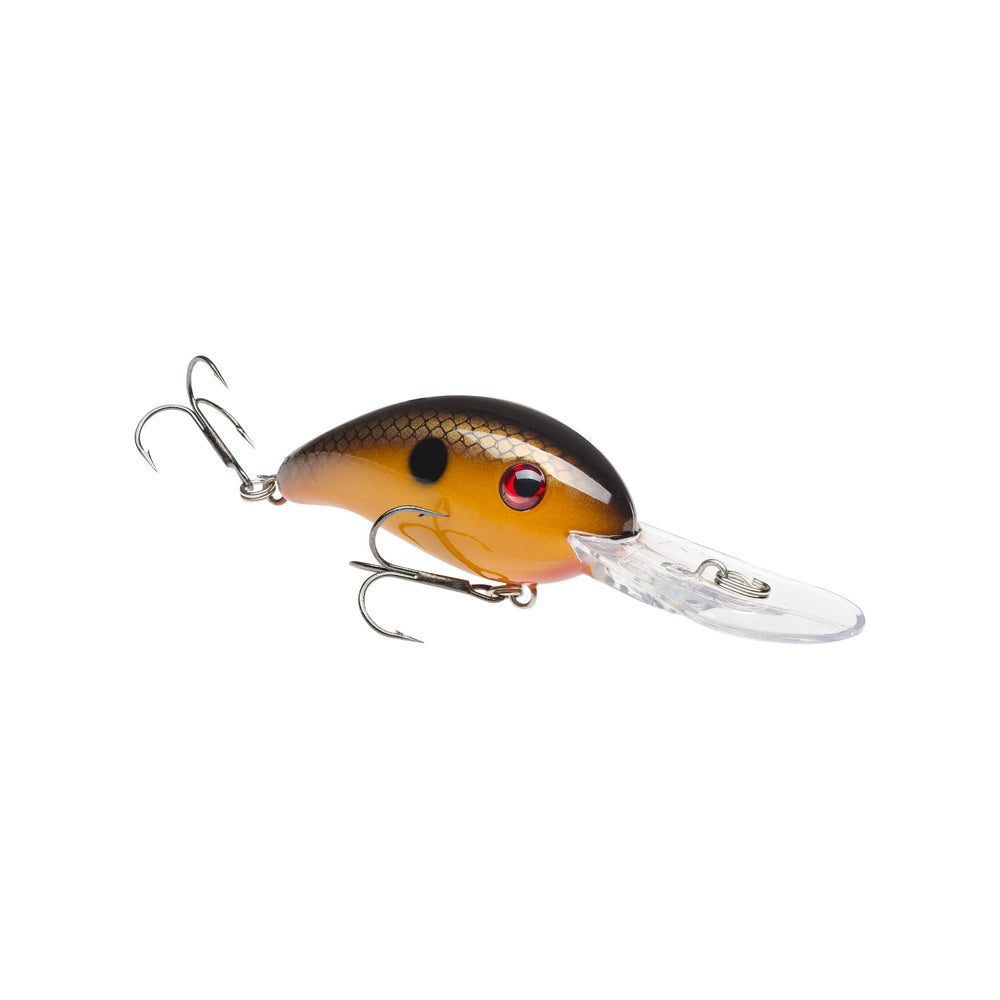 The Strike King 3XD Crankbait features a fish-shaped, black and brown scaled body with red eyes, two treble hooks, and a clear plastic bill—ideal for bass fishing.