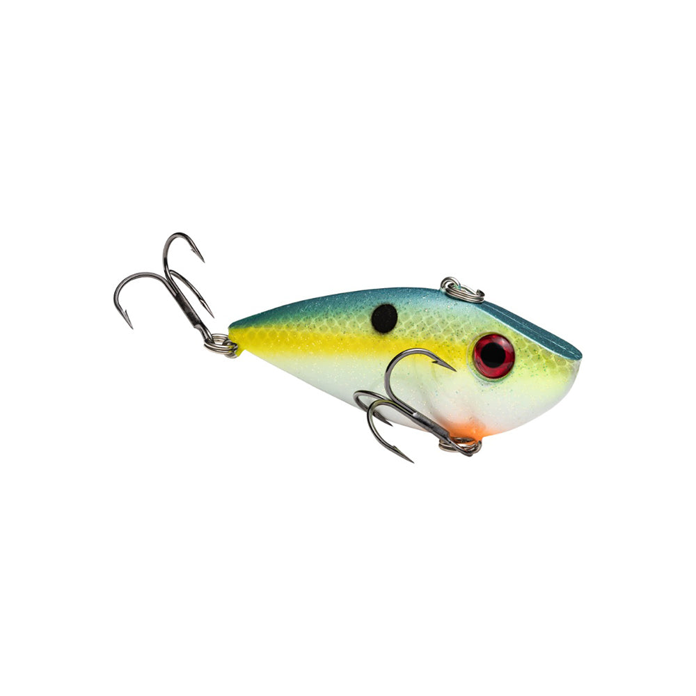 The Strike King Red Eye Shad is a vibrant, lipless crankbait shaped like a small fish, with a blue top, yellow sides, white belly, red eye, black spot on its side, and two premium hooks from the Strike King brand.