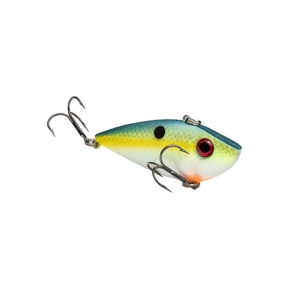 The Strike King Red Eye Shad is a vibrant, lipless crankbait shaped like a small fish, with a blue top, yellow sides, white belly, red eye, black spot on its side, and two premium hooks from the Strike King brand.