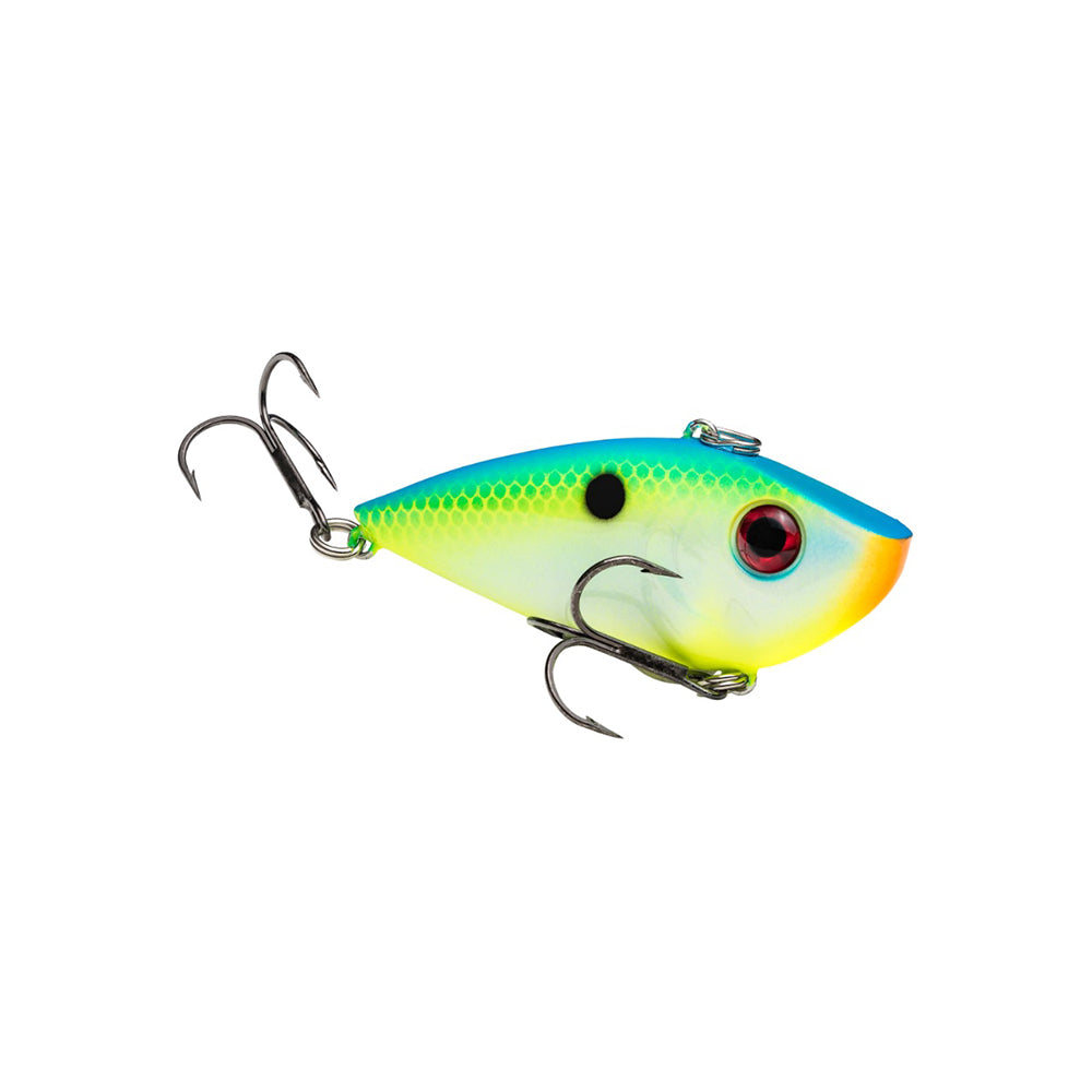 The Strike King Red Eye Shad by Strike King is a lipless crankbait shaped like a small fish, featuring a blue and yellow body, red eye, orange spot near the mouth, black dot on the side, and two premium hooks. Inspired by the classic Red Eye Shad design.