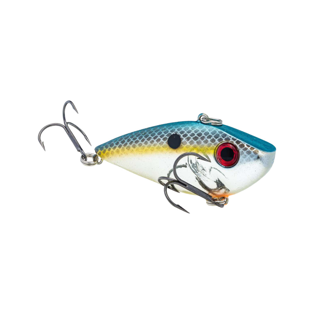 The Strike King Red Eye Shad by Strike King is a fish-shaped lipless crankbait featuring a blue top, yellow sides, red eyes, black dot, and two premium hooks to mimic a small baitfish.